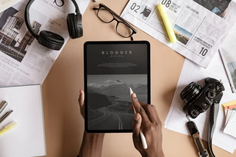 Person reviewing a website on a tablet at a desk